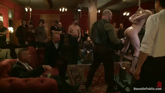 Poster: Partygoers beat and skull fuck a big dick stud in bondage.