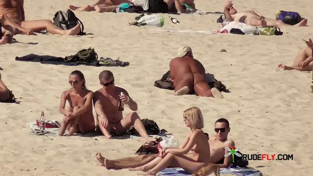 Poster: It just got hotter at the nude strand thanks to her