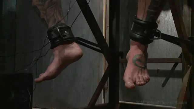 Poster: Pro Dom Ruckus takes the 30 pound flogger