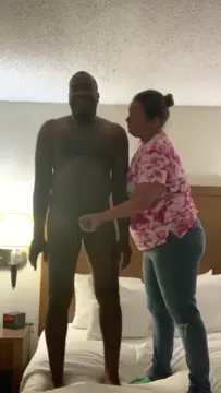 Poster: White girl gives black guy a hand job(porn)
